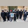 Maltese Navy officers hold a picture of Prince Phillip, outside his former residence, Villa Guardamangia in Pieta, in Valletta, Malta, Saturday, April 17, 2021. Prince Philip, husband of Queen Elizabeth II, died April 9 at the age of 99. His funeral service is taking place Saturday at St. George's Chapel in Windsor Castle. (AP Photo/Rene' Rossignaud)