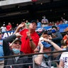 Fans scramble for a foul ball.