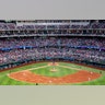 Fans fill the stands at Globe Life Field during the second inning of a baseball game between the Texas Rangers and the Toronto Blue Jays.