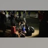 A man is injured as protesters clash with police in front of the Brooklyn Center Police station on Sunday, April 11, 2021, in Brooklyn Center, Minnesota. The family of Daunte Wright, 20, told a crowd that he was shot by police Sunday before getting back into his car and driving away, then crashing the vehicle several blocks away. The family said Wright was later pronounced dead.