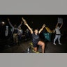 A woman who was tear gassed while confronting police raises her arms outside Brooklyn Center Police Department after police allegedly shot and killed a man who local media report is identified by the victim's mother as Daunte Wright, in Brooklyn Center, Minnesota, April 11, 2021.