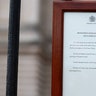 An announcement is displayed at the fence of Buckingham Palace after it was announced that Britain's Prince Philip, husband of Queen Elizabeth, has died at the age of 99, in London, Britain, April 9, 2021. REUTERS/Hannah McKay