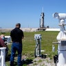 Photographers set up remote cameras before a SpaceX Falcon 9 rocket launch at the Kennedy Space Center on Thursday, April, 22, 2021, in Cape Canaveral, Fla. SpaceX aimed to launch its third crew a little before sunrise Friday, this time using a recycled capsule and rocket. (AP Photo/Brynn Anderson)