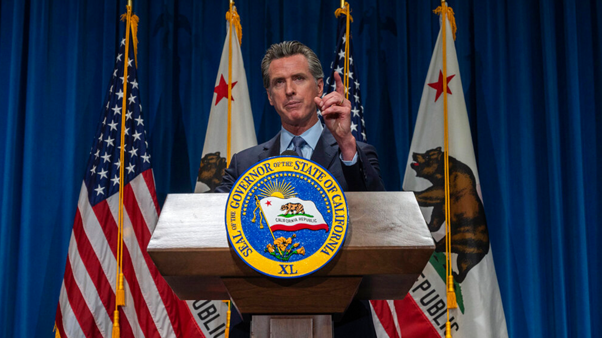 FILE: California Gov. Gavin Newsom answers questions from reporters after delivering his revised budget proposal at a press conference in Sacramento, Calif. 