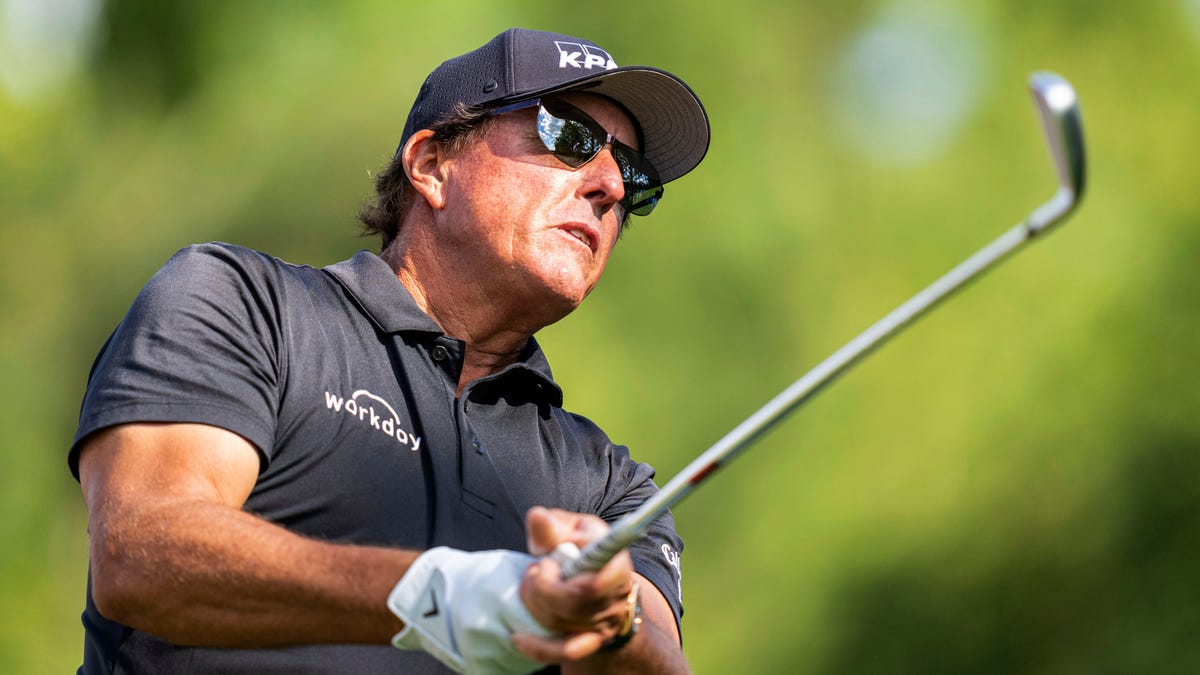 Phil Mickelson watches his tee shot on the sixth hole during the first round of the Wells Fargo Championship golf tournament at Quail Hollow on Thursday, May 6, 2021, in Charlotte, N.C. 