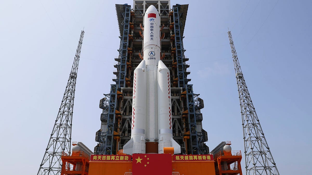 In this photo released by Xinhua News Agency, the core module of China's space station, Tianhe, on the the Long March-5B Y2 rocket is moved to the launching area of the Wenchang Spacecraft Launch Site in southern China's Hainan Province on April 23, 2021. (Guo Wenbin/Xinhua via AP)