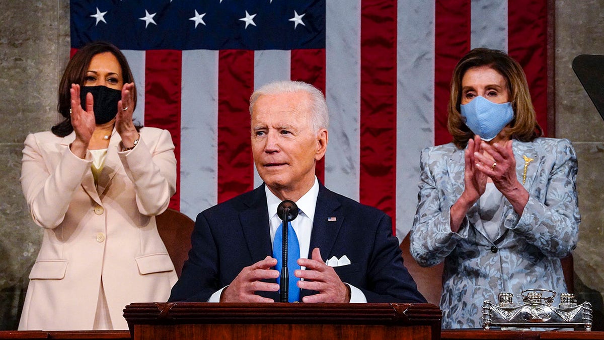 Vice President Kamala Harris and House Speaker Nancy Pelosi of Calif., stand and applaud as President Joe Biden addresses a joint session of Congress, Wednesday, April 28, 2021, in the House Chamber at the U.S. Capitol in Washington. (Melina Mara/The Washington Post via AP, Pool)