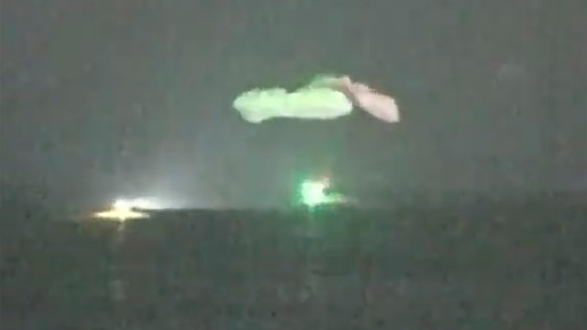 In this image made from NASA TV video, the SpaceX Dragon capsule lands into the Gulf of Mexico near the Florida Panhandle early Sunday, May 2, 2021. SpaceX returned four astronauts from the International Space Station on Sunday, making the first U.S. crew splashdown in darkness since the Apollo 8 moonshot. (NASA TV via AP)