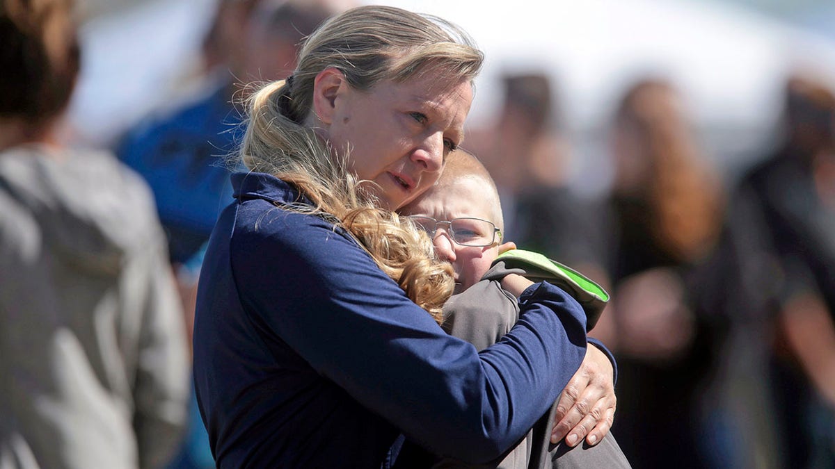 People embrace after a school shooting at Rigby Middle School in Rigby, Idaho, on Thursday. (John Roark/The Idaho Post-Register via AP)