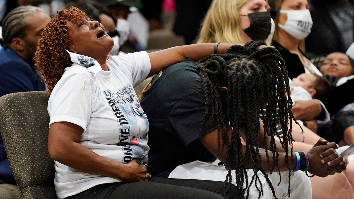 Family members react during the funeral for Andrew Brown Jr., Monday, May 3, 2021, at Fountain of Life Church in Elizabeth City, N.C. (AP Photo/Gerry Broome)