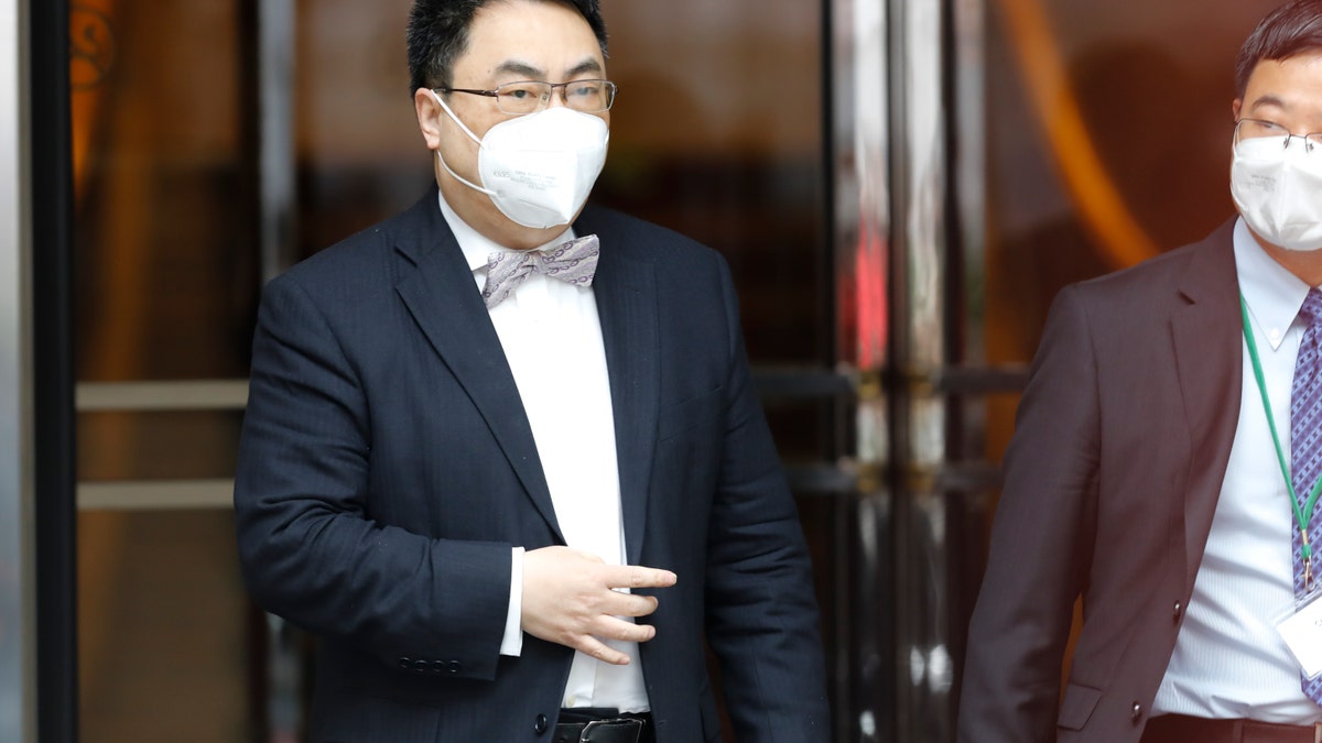The ambassador of the Permanent Mission of the People's Republic of China to the United Nations, Wang Qun, leaves the Grand Hotel Wien, where closed-door nuclear talks with Iran take place in Vienna, Austria, Friday, May 7, 2021. (AP Photo/Lisa Leutner)