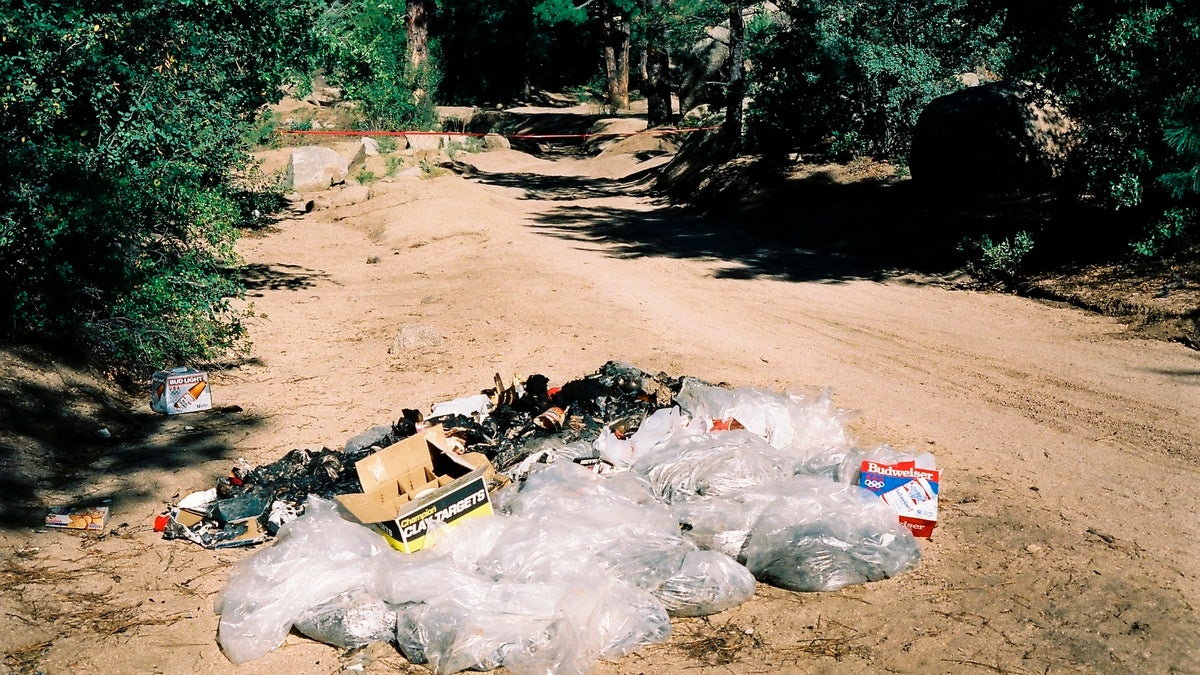 This undated photo provided by the Yavapai County Sheriff's Office shows the site outside Prescott, Arizona, where Pamela Pitts' body was found in 1988 among a pile of trash. Pitts' then-roommate, Shelly Harmon, recently confessed to killing her and was sentenced to time she already had served in another killing. (Yavapai County Sheriff's Office via AP)