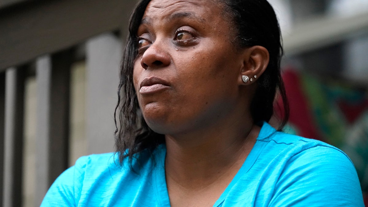 Tammie Townsend tears up as she speaks about her eldest son, Willie Jones Jr., and his attentiveness and love for his son at the family home in Forest, Miss., April 27, 2021. Jones, was 21 when he was found hanging from a tree in his girlfriend's Scott County yard three years ago. A Hinds County judge recently awarded the family $11 million in a civil suit related to his death. (AP Photo/Rogelio V. Solis)