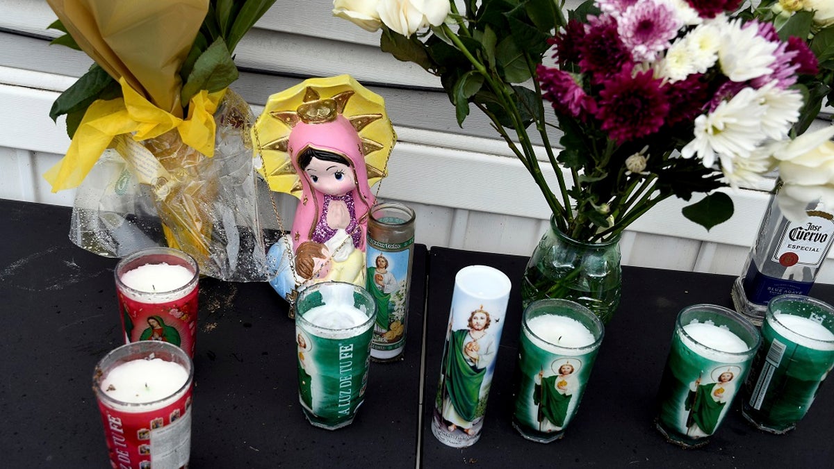 A memorial is seen on Monday outside a mobile home in Colorado Springs, Colo., where a shooting at a party took place a day earlier that killed six people before the gunman took his own life. (AP Photo/Thomas Peipert)