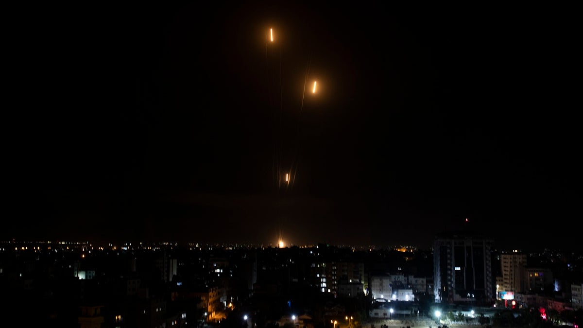 Rockets are launched from the Gaza Strip towards Israel on Tuesday. The barrage of rockets from the Gaza Strip and airstrikes into the territory continued almost nonstop throughout the day, in what appeared to be some of the most intense fighting between Israel and Hamas since their 2014 war.(AP Photo/Khalil Hamra)