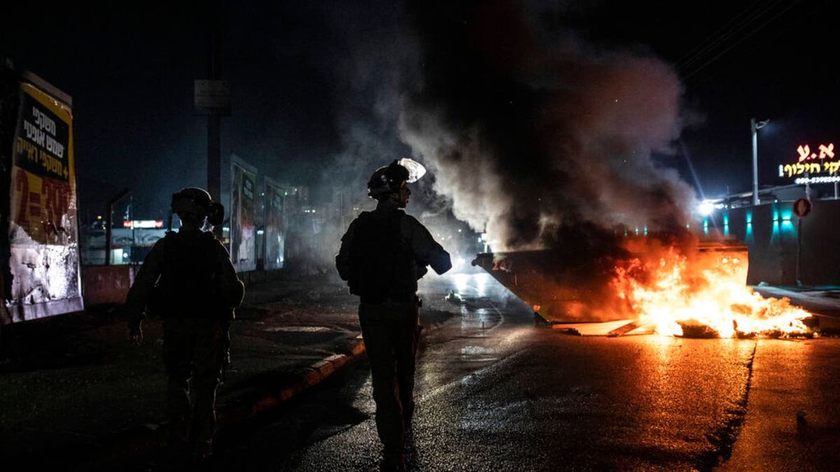 Israeli police patrol during clashes between Arabs, police and Jews, in the mixed town of Lod, central Israel, Wednesday, May 12, 2021. 
