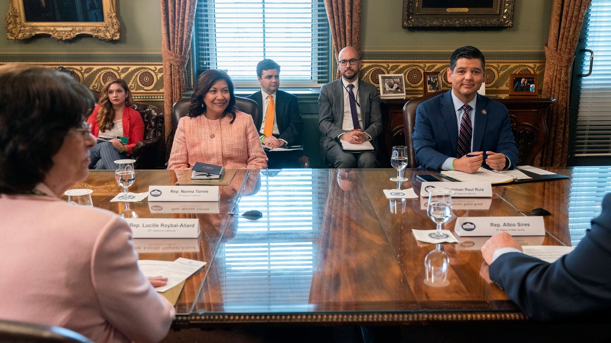 Clockwise from left, Rep. Norma Torres, D-Calif., Rep. Lucille Roybal-Allard, D-Calif., Congressional Hispanic Caucus (CHC) Chair Rep. Raul Ruiz, D-Calif., and Rep. Albio Sires, D- N.J., attend a meeting with Vice President Kamala Harris with the CHC, in her ceremonial office, Monday, May 17, 2021, on the White House complex in Washington. (AP Photo/Jacquelyn Martin)