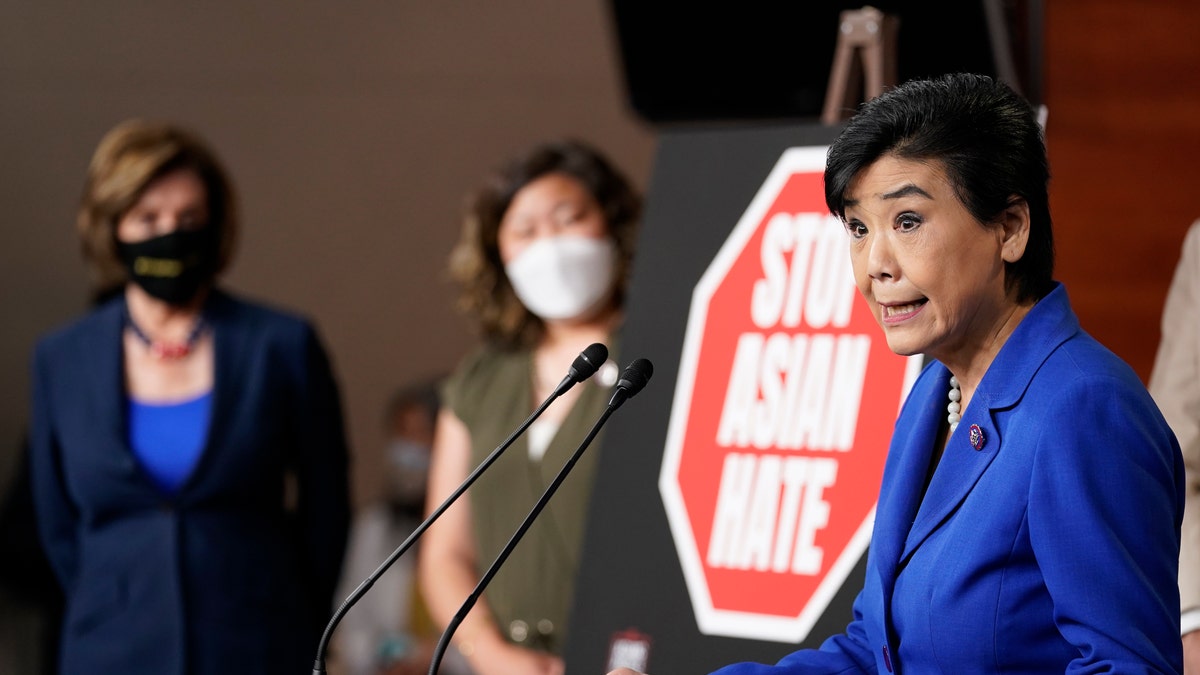 Rep. Judy Chu, D-Calif., right, speaks during a news conference on Capitol Hill in Washington, Tuesday, May 18, 2021, on the COVID-19 Hate Crimes Act as House Speaker Nancy Pelosi of Calif., left, and Rep. Grace Meng, D-N.Y., center, listen. (AP Photo/Susan Walsh)