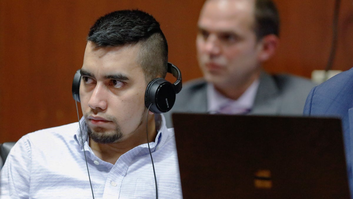 Cristhian Bahena Rivera listens to testimony that has been translated into Spanish by an interpreter during his trial at the Scott County Courthouse in Davenport, Iowa. (Jim Slosiarek/The Gazette via AP, Pool) 