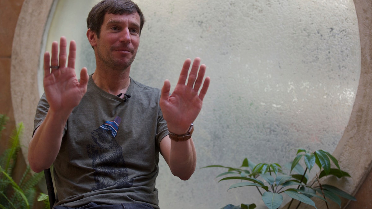 Mountain guide Lukas Furtenbach speaks to The Associated Press in Kathmandu, Nepal, Saturday, May 22, 2021. Furtenbach, an expert climbing guide said Saturday that a coronavirus outbreak on Mount Everest has infected at least 100 climbers and support staff, giving the first comprehensive estimate amid official Nepalese denials of a COVID-19 cluster on the world’s highest peak. (AP Photo/Bikram Rai)