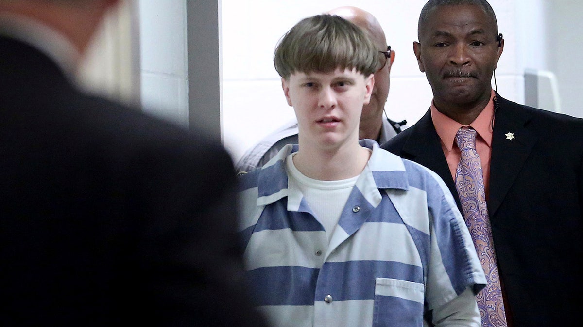 In this April 10, 2017, file photo, Dylann Roof enters the courtroom at the Charleston County Judicial Center in Charleston, S.C. On Tuesday, May 25, 2021,  (Grace Beahm/The Post And Courier via AP, Pool, File)
