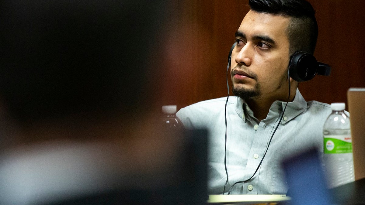 Cristhian Bahena Rivera listens to court proceedings in his trial on Monday in the Scott County Courthouse, in Davenport, Iowa. Defense lawyers argued that Bahena Rivera is a hard-working, family-centered immigrant from Mexico who was pressured into making a false confession in connection with the death of Mollie Tibbetts in July 2018. (Kelsey Kremer/The Des Moines Register via AP, Pool)