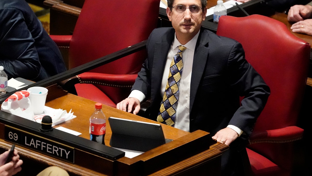 FILE - In this May 4, 2021, file photo, State Rep. Justin Lafferty, R-Knoxville, watches the tally board during a vote in the House of Representatives in Nashville, Tenn. Lafferty falsely declared that an original constitutional provision designating a slave as three-fifths of a person was adopted for "the purpose of ending slavery," commenting amid a debate over whether educators should be restricted while teaching about systematic racism in America. (AP Photo/Mark Humphrey, File)