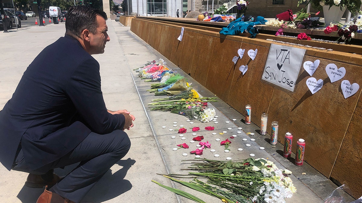 San Jose Mayor Sam Liccardo stops to view a makeshift memorial for the rail yard shooting victims in front of City Hall in San Jose, Calif., on Thursday, May 27, 2021. (Associated Press)