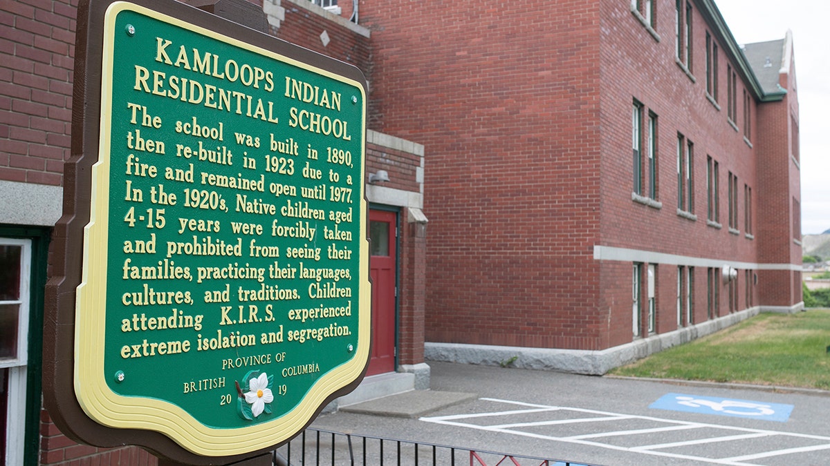 A plaque is seen outside of the former Kamloops Indian Residential School on Tk'emlups te Secwépemc First Nation in Kamloops, British Columbia, Canada on Thursday, May 27, 2021. The remains of 215 children have been found buried on the site of the former residential school in Kamloops.  (Associated Press)