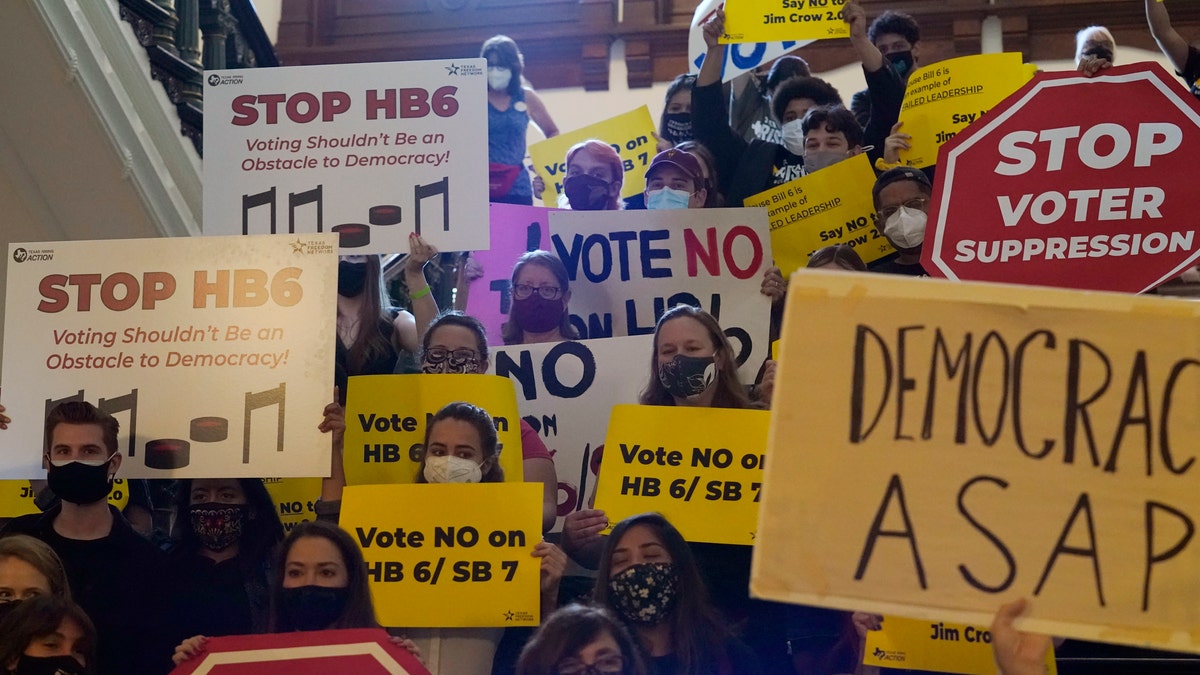 In this May 6, 2021 file photo, a group opposing new voter legislation gather outside the House Chamber at the Texas Capitol in Austin, Texas. (AP Photo/Eric Gay, File)