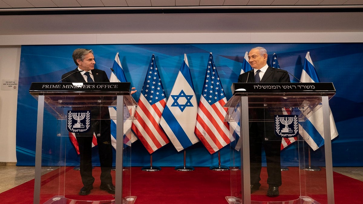 Secretary of State Antony Blinken, left, speaks as Israeli Prime Minister Benjamin Netanyahu listens during a joint statement after a meeting at the Prime Minister's office, Tuesday, May 25, 2021, in Jerusalem, Israel. (AP Photo/Alex Brandon, Pool)
