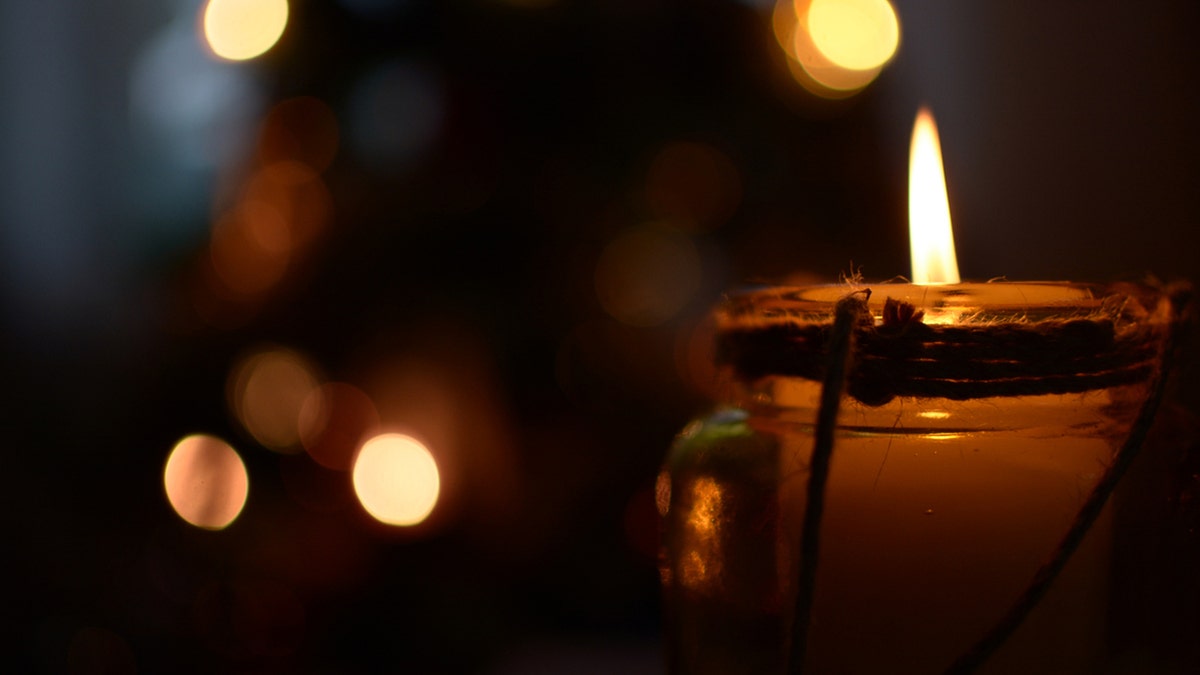 Candle lit in dark