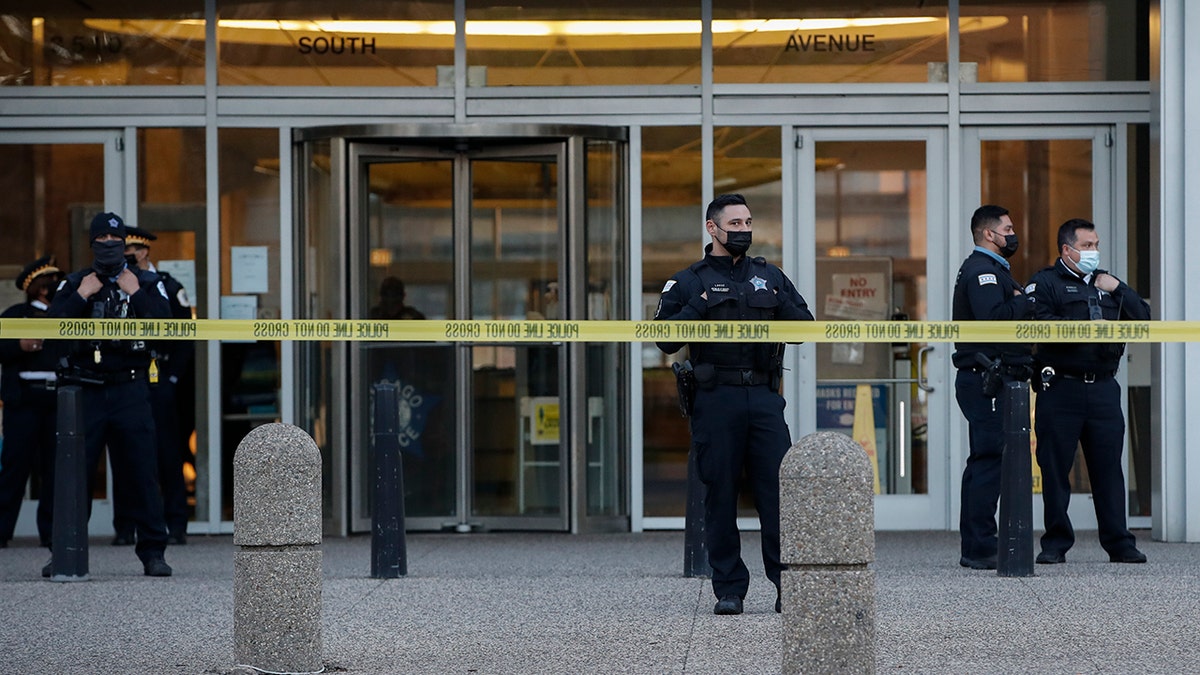 Chicago Police officers guard the front entrance the their headquarters building during a rally on April 15, 2021 in Chicago, Illinois. (Kamil Krzaczynski/Getty Images)