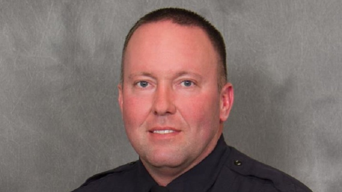 Champaign, Ill., Police Officer Chris Oberheim, 44, was killed Wednesday by a gunman while responding to a domestic disturbance call. 