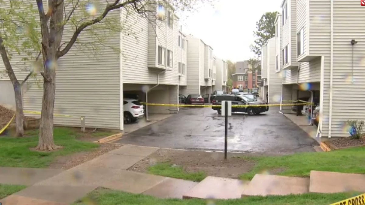 Police tape blocks entry into an apartment complex where Englewood police officers were struck by a motorist. 