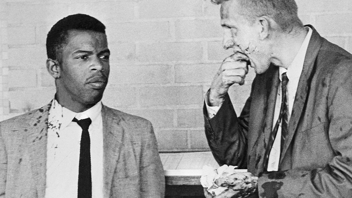 Two blood-splattered Freedom Riders, John Lewis (1940 - 2020, left) and James Zwerg stand together after being attacked and beaten by pro-segregationists in Montgomery, Alabama, May 20, 1961.