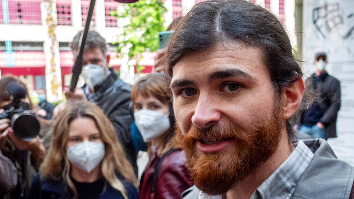 The defendant identified only as 1st Lt. Franco A. due to German privacy rules, walks to a court for the start of a trial on charges of preparing a serious act of violence endangering the state in Frankfurt, Germany, Thursday, May 20, 2021. 