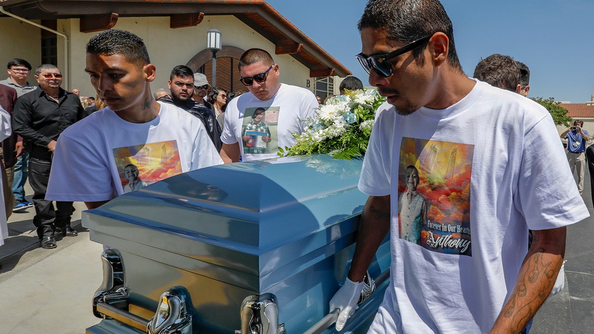 Victor Avalos, right, father of Anthony Avalos, and other family members bring out the casket after funeral services held at Saint Junipero Serra Parish on July 20, 2018 in Quartz Hills, California. (Getty Images)