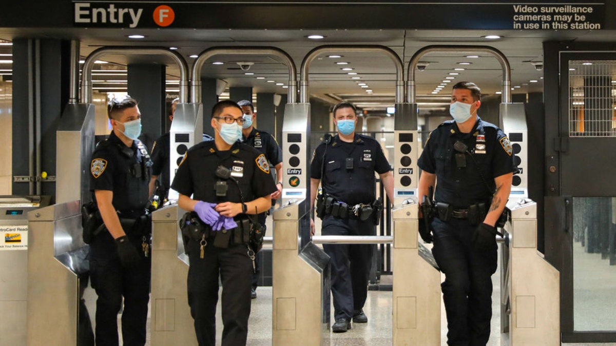 NEW YORK, NY - MAY 15: Police officers on patrol around Times Square subway station on May 15, 2020 in New York City. (Photo by Jose Perez/Bauer-Griffin/GC Images)