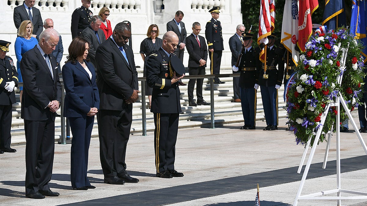 President Joe Biden , Vice President Kamala Harris, Defense Secretary Lloyd Austin and Maj. Gen. Omar Jones take part in a wreath-laying ceremony at the Tomb of the Unknown Soldier at Arlington National Cemetery on Memorial Day, May 31, 2021.