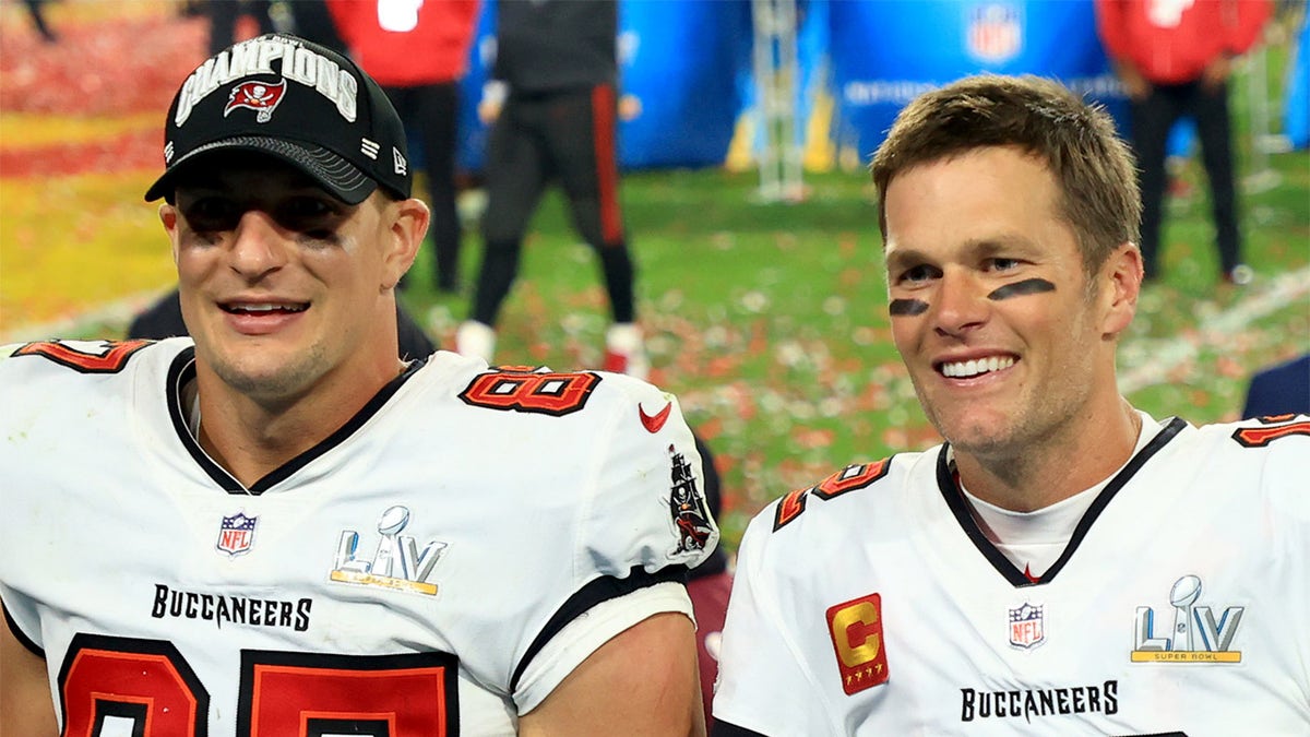 Rob Gronkowski #87 and Tom Brady #12 of the Tampa Bay Buccaneers celebrate after defeating the Kansas City Chiefs in Super Bowl LV at Raymond James Stadium on February 07, 2021, in Tampa, Florida. The Buccaneers defeated the Chiefs 31-9.