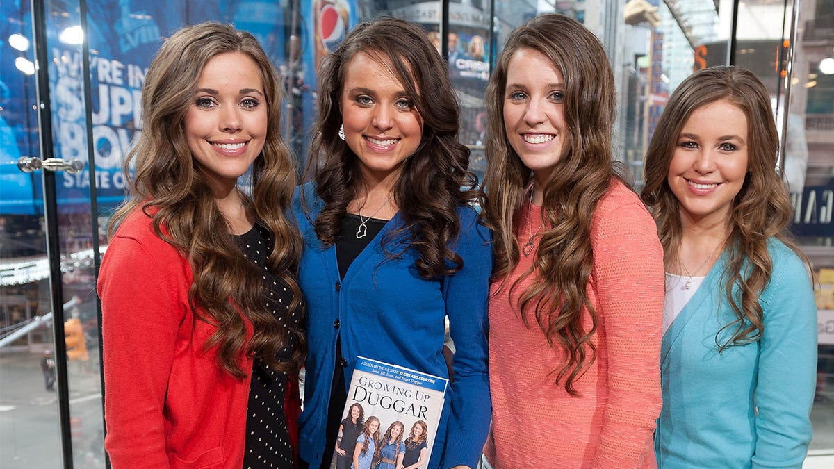(L-R) Jessa Duggar, Jinger Duggar, Jill Duggar, and Jana Duggar are seen at a TV studio in March 2014. Jana, far right, is charged with endangering the wellbeing of a child.