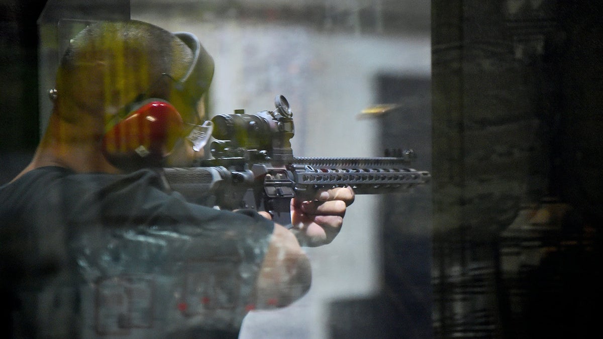 Gun enthusiast Josue Perez fires an AR15 rifle at the LAX Firing Range in Inglewood, California on September 7, 2016. / AFP / Frederic J. BROWN / TO GO WITH AFP STORY BY VERONIQUE DUPONT-"Gun-toting Democrats bristle at firearms limits in California" (Photo credit should read FREDERIC J. BROWN/AFP via Getty Images)
