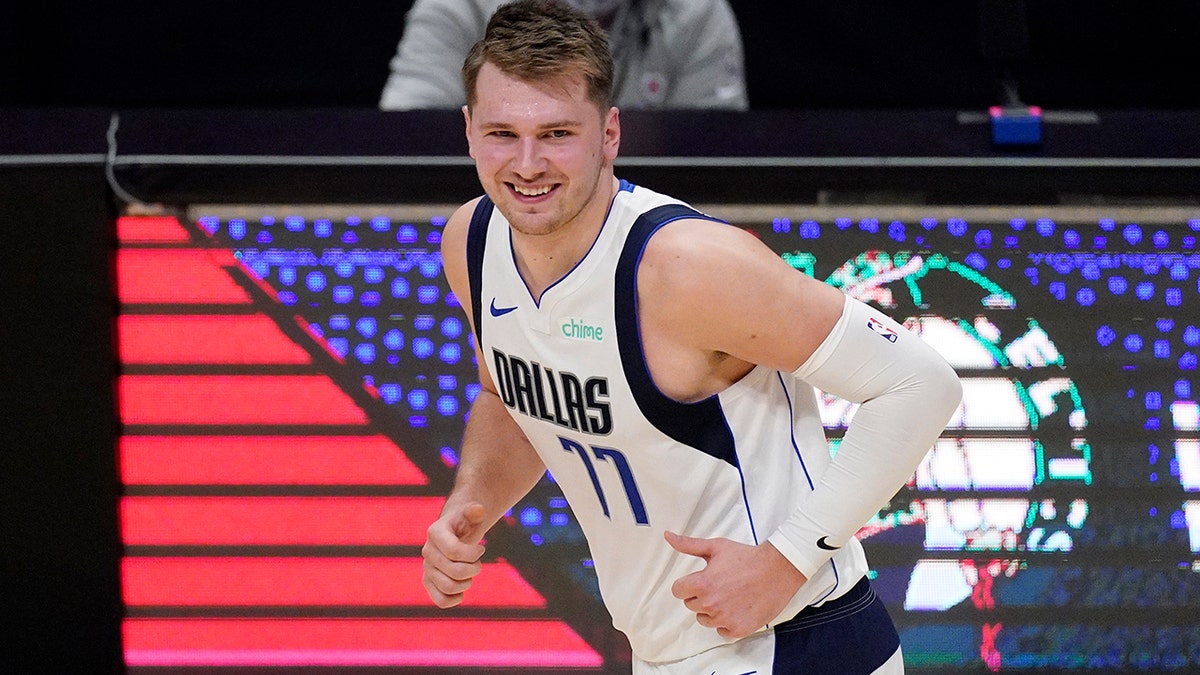 Dallas Mavericks guard Luka Doncic smiles after scoring during the first half in Game 1 of an NBA basketball first-round playoff series against the Los Angeles Clippers Saturday, May 22, 2021, in Los Angeles.