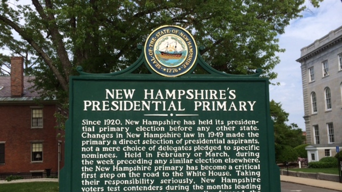 A sign by New Hampshire's state capital building marking the state's century-old tradition of holding the first presidential primary in the race for the White House, in Concord, N.H.