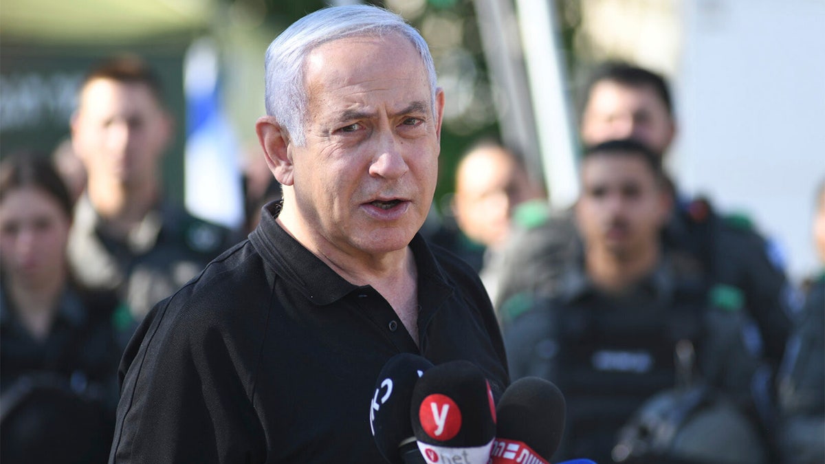 Israeli Prime Minister Benjamin Netanyahu meets with Israeli border police on Thursday, May 13, 2021 in Lod, near Tel Aviv after a wave of violence in the city the night before. (AP Photo/Yuval Chen, Yediot Ahronot, Pool)
