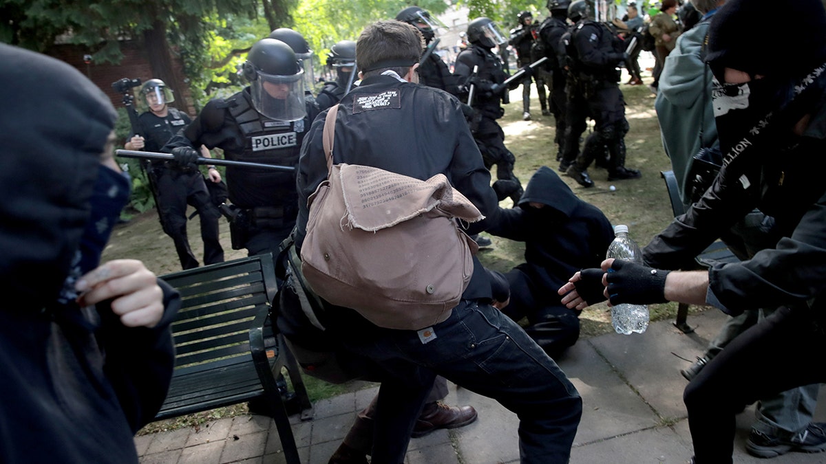 PORTLAND, OR - JUNE 04: Police clash with demonstrators as they try to clear 'Antifa' members and anti-Trump protesters from the area during a protest on June 4, 2017 in Portland, Oregon. Police used tear gas, flash bangs, and rubber bullets to clear the crowd. A protest dubbed "Trump Free Speech" by organizers was met by a large contingent of counter-demonstrators who viewed the protest as a promotion of racism. The demonstrations come in the wake of the recent violent attack on the city's MAX train line when Ricky Best, 53, and Taliesin Namkai-Meche, 23, were stabbed to death and Micah Fletcher,21, was severely injured after they tried to protect two teenage girls, one of whom was wearing a hijab, from being harassed with racial taunts by suspect Jeremy Christian. (Photo by Scott Olson/Getty Images)