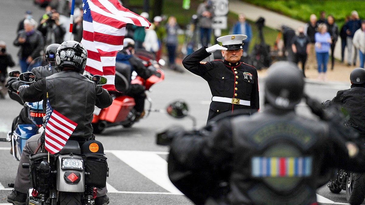 Staff Sgt. Tim Chambers salutes as motorcyclists participate in the "Rolling to Remember" demonstration as they ride past the Lincoln Memorial on May 30, 2021, in Washington, DC. The event is to honor American prisoners of war and service members missing in action, and to call attention to veterans' issues. (OLIVIER DOULIERY/AFP via Getty Images)