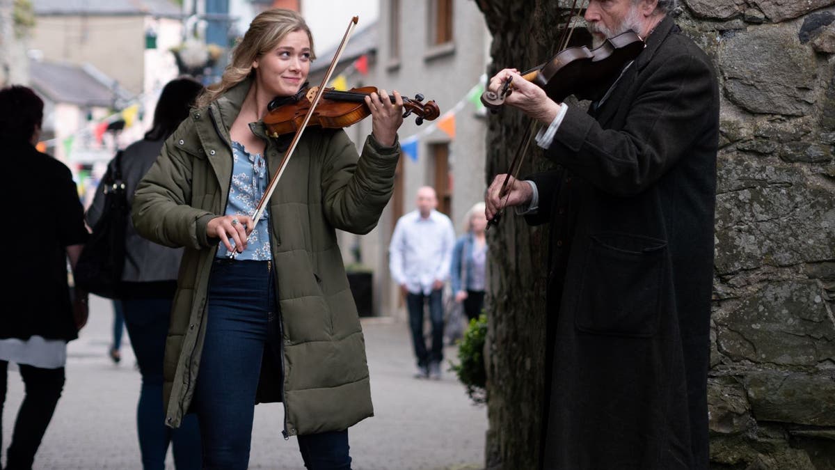 Rose Reid and Patrick Bergin play traditional Irish music in 'Finding You.'