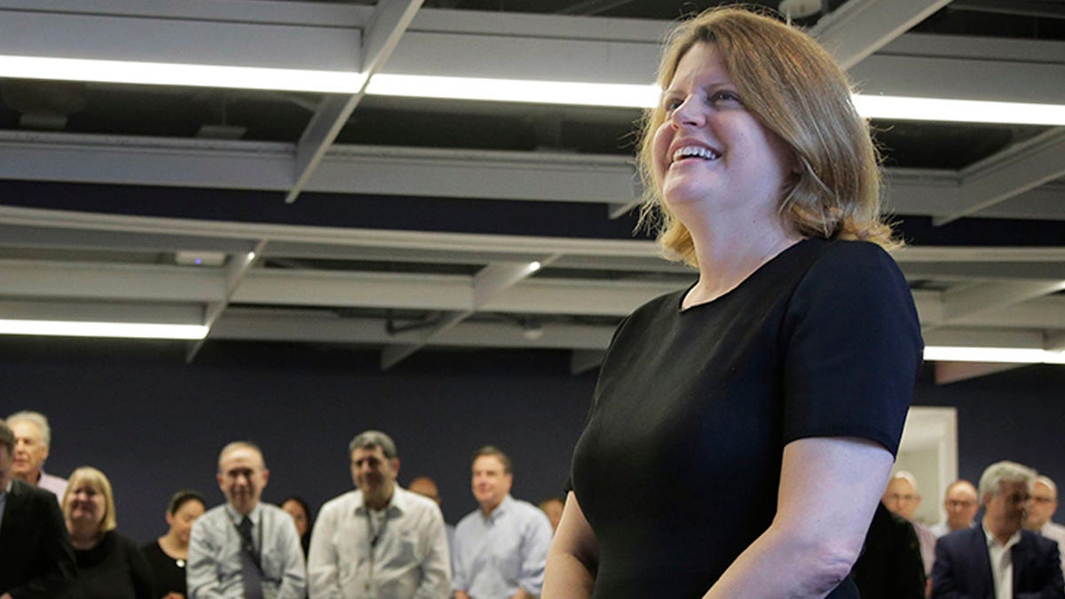 Associated Press Executive Editor Sally Buzbee and other staff members gather to celebrate at AP headquarters in New York, Monday, April 15, 2019. A team of three Associated Press journalists won a Pulitzer Prize in international reporting Monday for their work documenting torture, graft and starvation in Yemen's brutal civil war. (AP Photo/Seth Wenig)